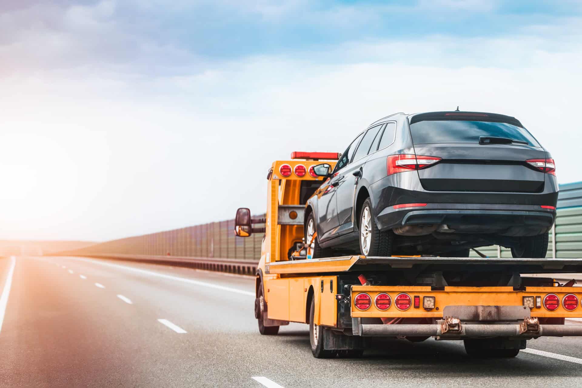 Roadside help service transporting disabled vehicle